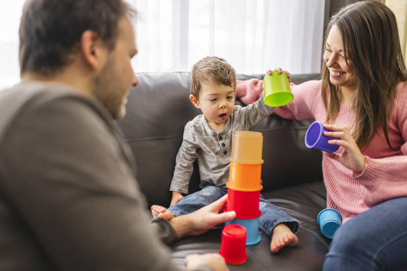 family playing with toddler