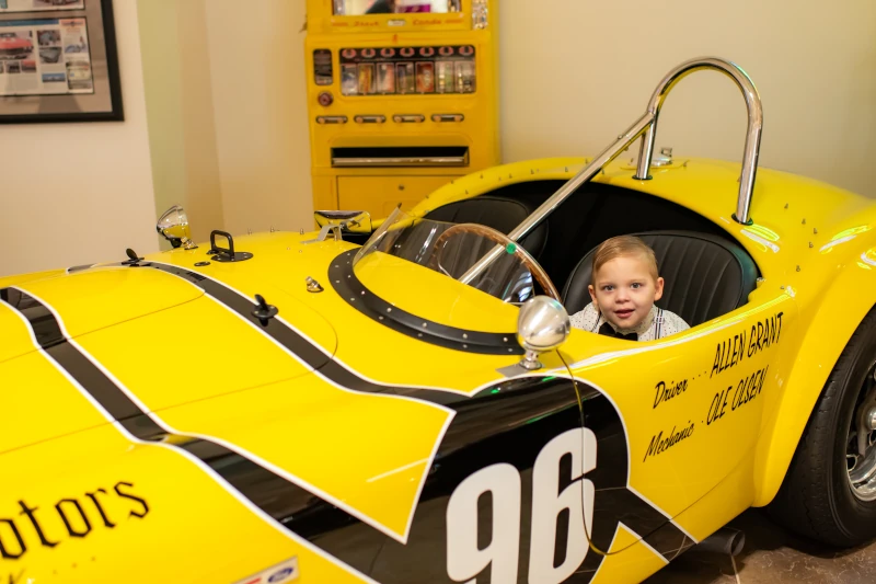 boy in yellow car